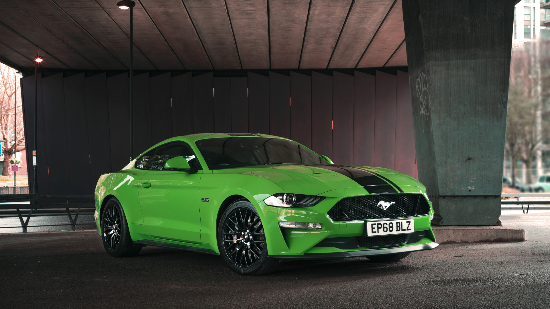 Green Porsche 911 Parked Beside Brown Brick Wall. Wallpaper in 1920x1080 Resolution