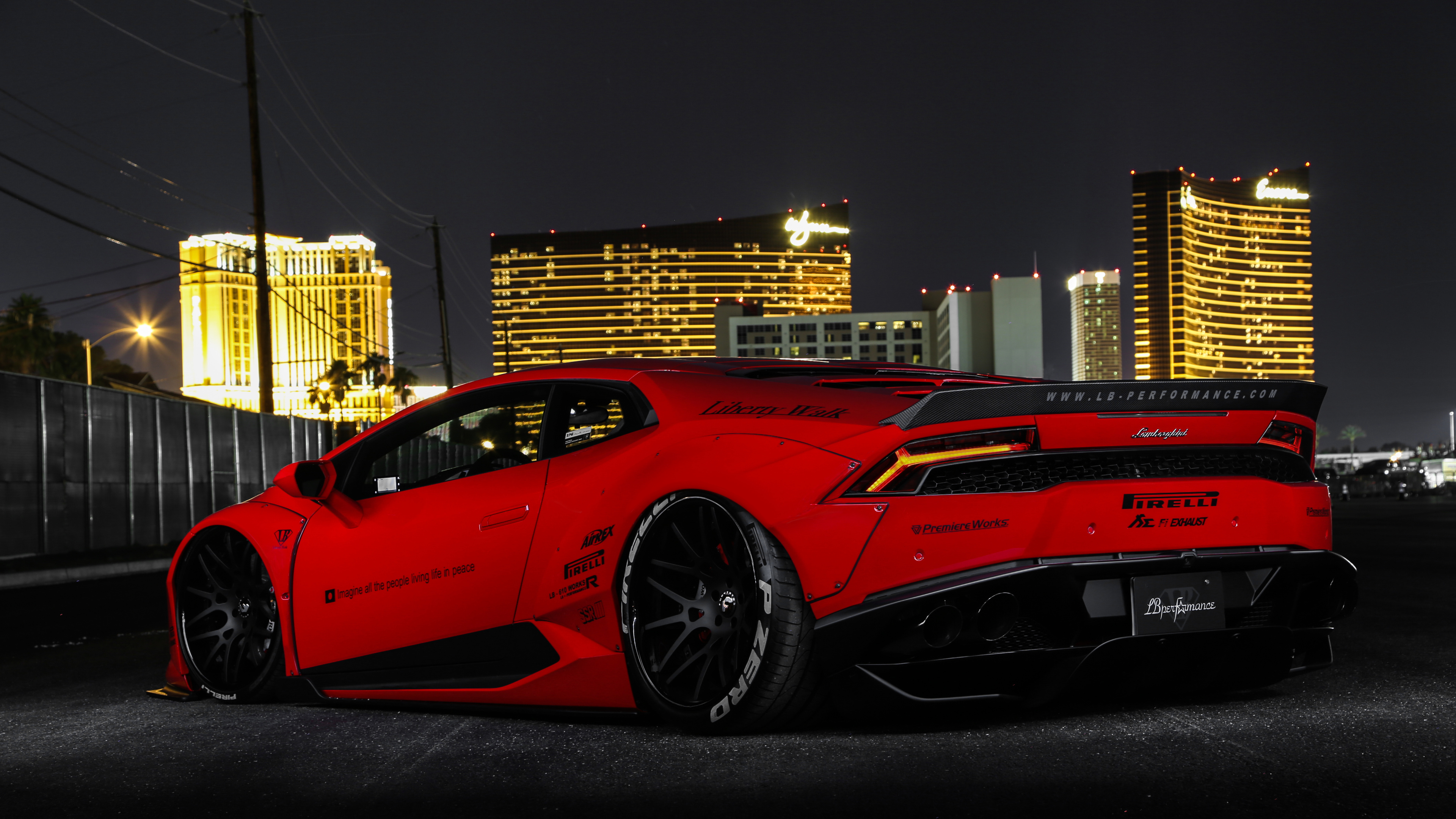 Red Ferrari 458 Italia Parked Near Building During Night Time. Wallpaper in 3840x2160 Resolution