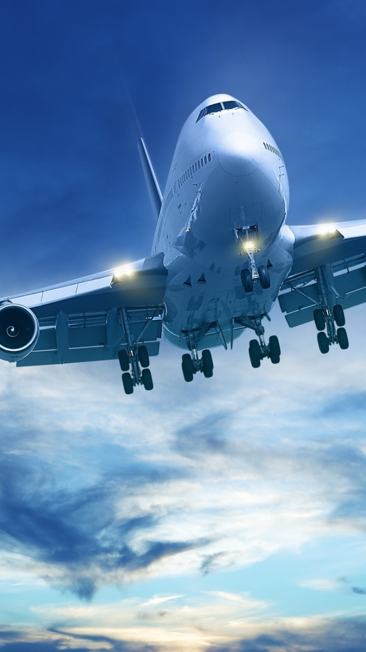 White Airplane Under Blue Sky During Daytime. Wallpaper in 750x1334 Resolution