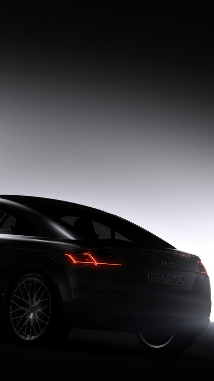 Porsche 911 Coupé Noir Dans Une Pièce Grise. Wallpaper in 750x1334 Resolution