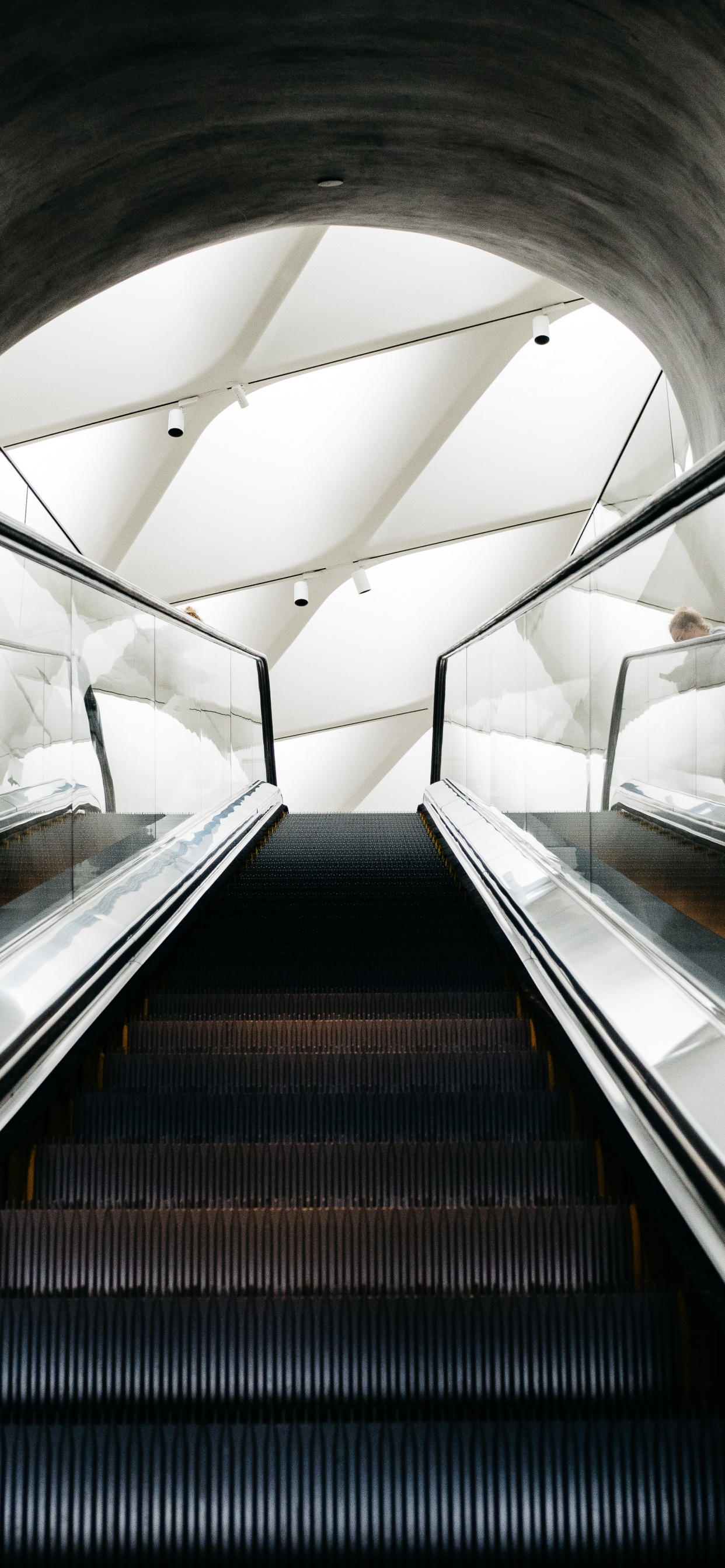 Black Escalator in a Tunnel. Wallpaper in 1242x2688 Resolution