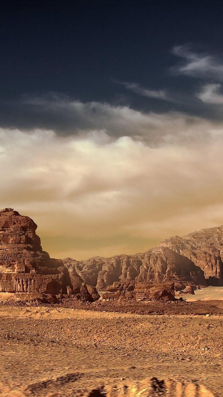 Montagne Rocheuse Brune Sous Ciel Nuageux Pendant la Journée. Wallpaper in 720x1280 Resolution