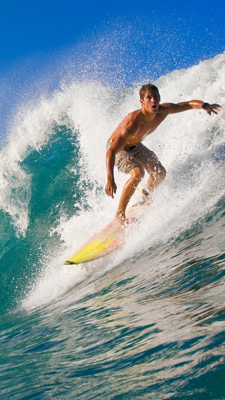 Man Surfing on Blue Sea During Daytime. Wallpaper in 750x1334 Resolution