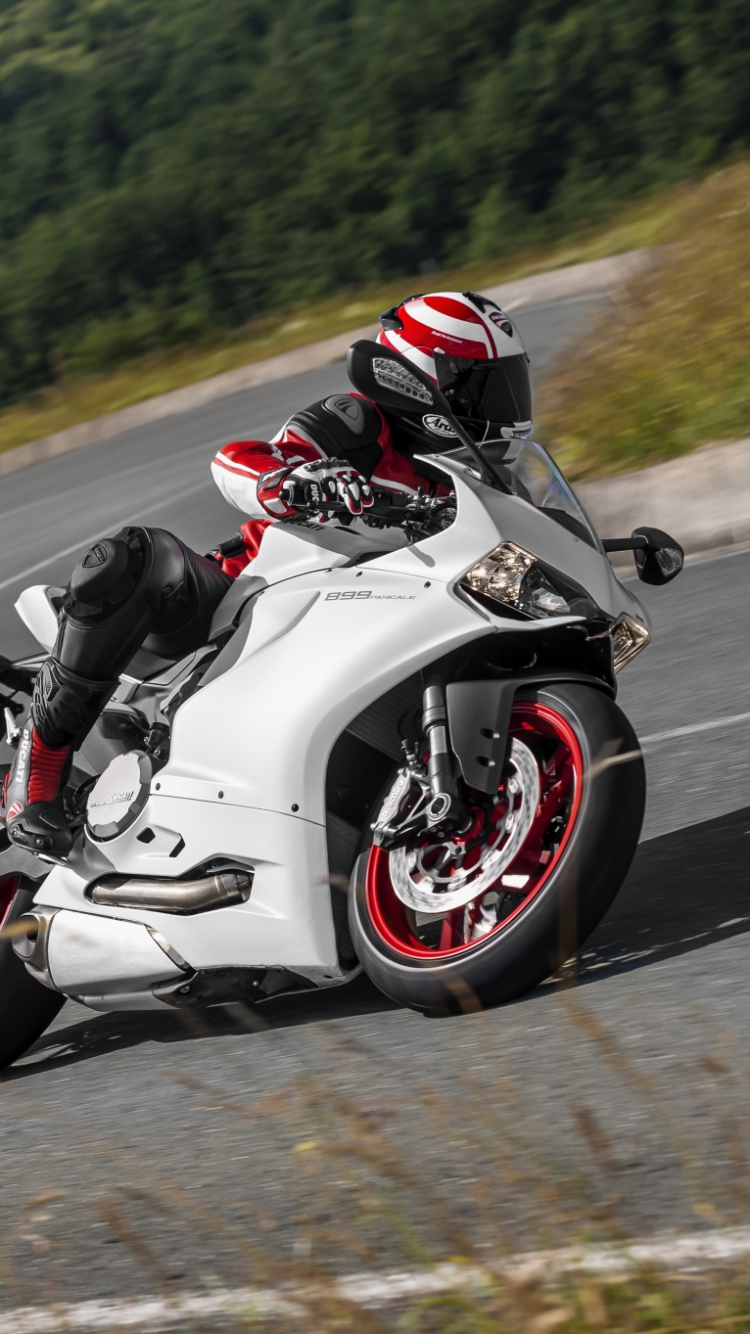 Man Riding on White and Black Sports Bike on Road During Daytime. Wallpaper in 750x1334 Resolution