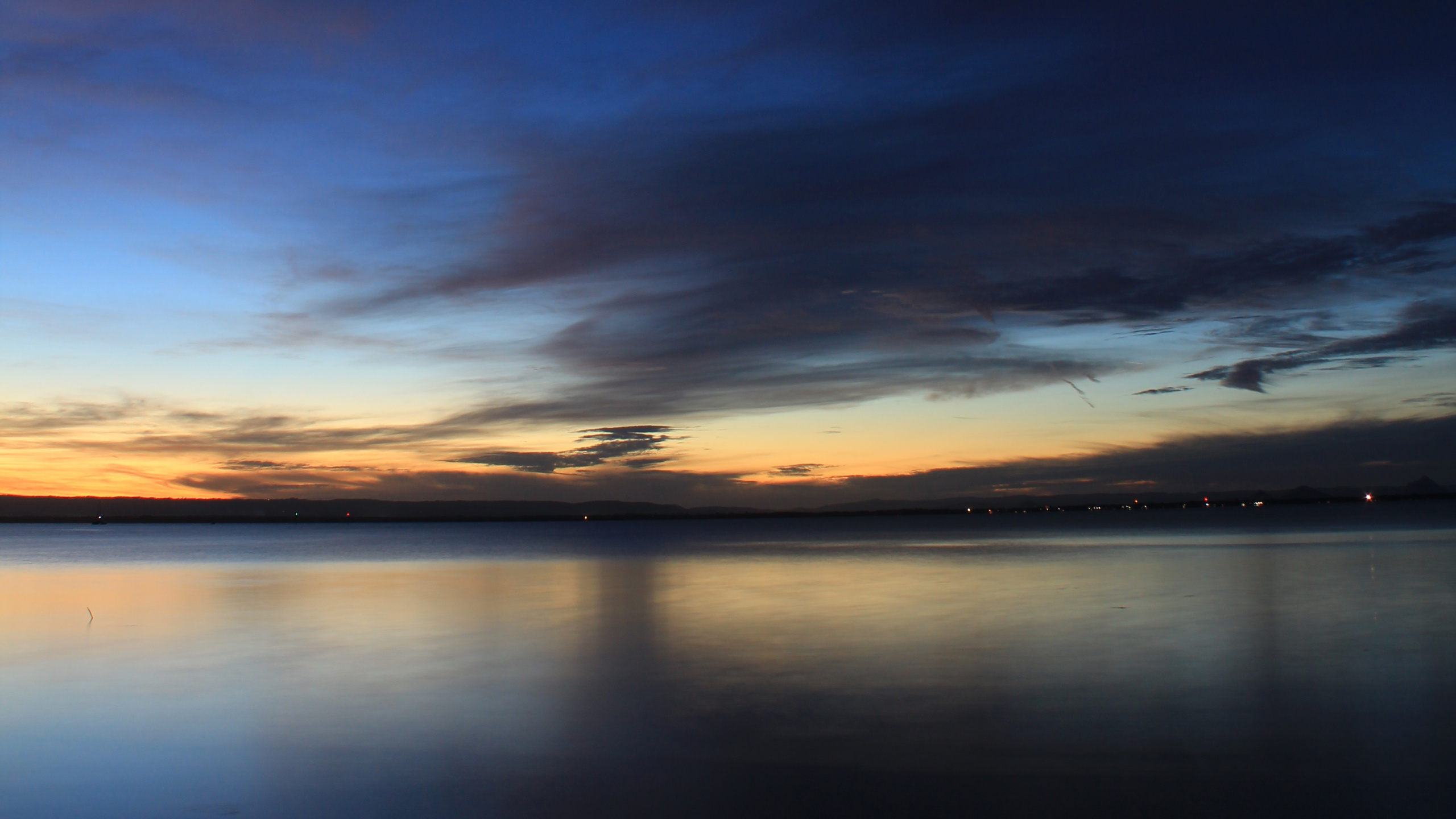 Body of Water Under Blue Sky During Sunset. Wallpaper in 2560x1440 Resolution