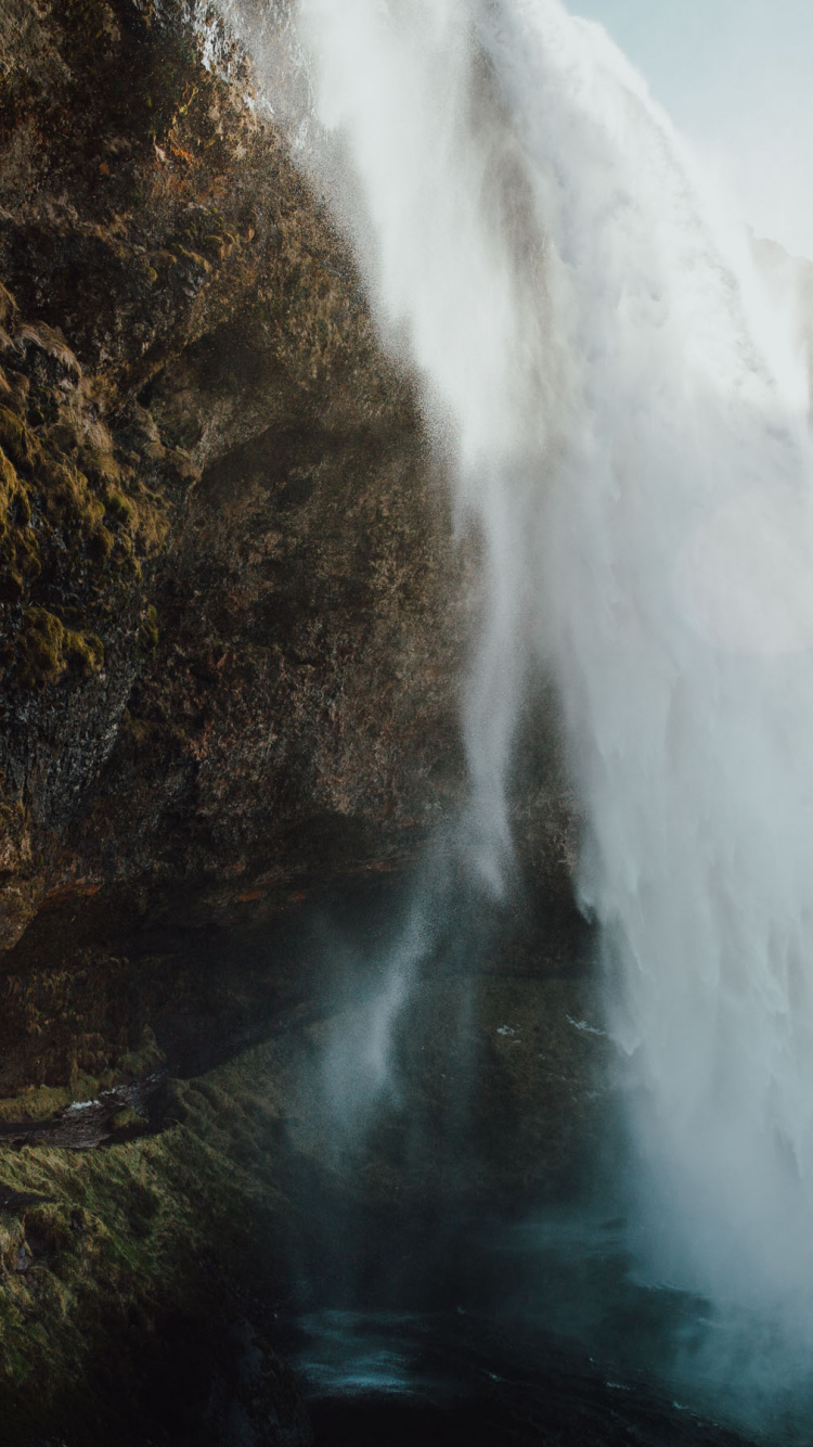 Waterfalls on Brown Rocky Mountain During Daytime. Wallpaper in 750x1334 Resolution