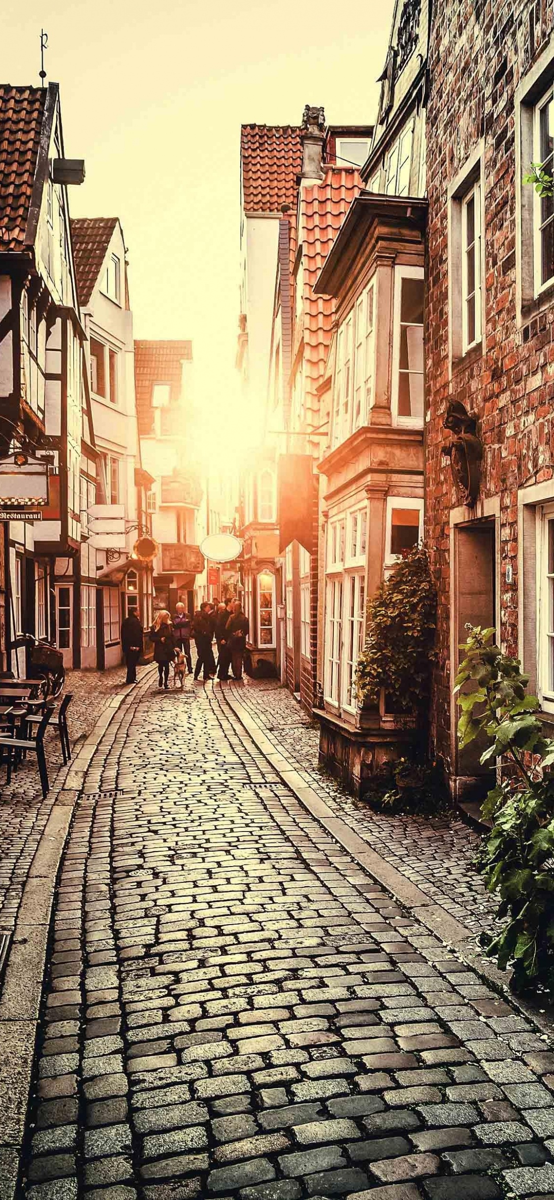 Bâtiment en Béton Marron et Blanc Pendant la Journée. Wallpaper in 1125x2436 Resolution