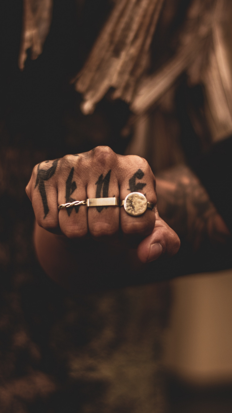 Grayscale Photo of Person Holding Ring. Wallpaper in 750x1334 Resolution