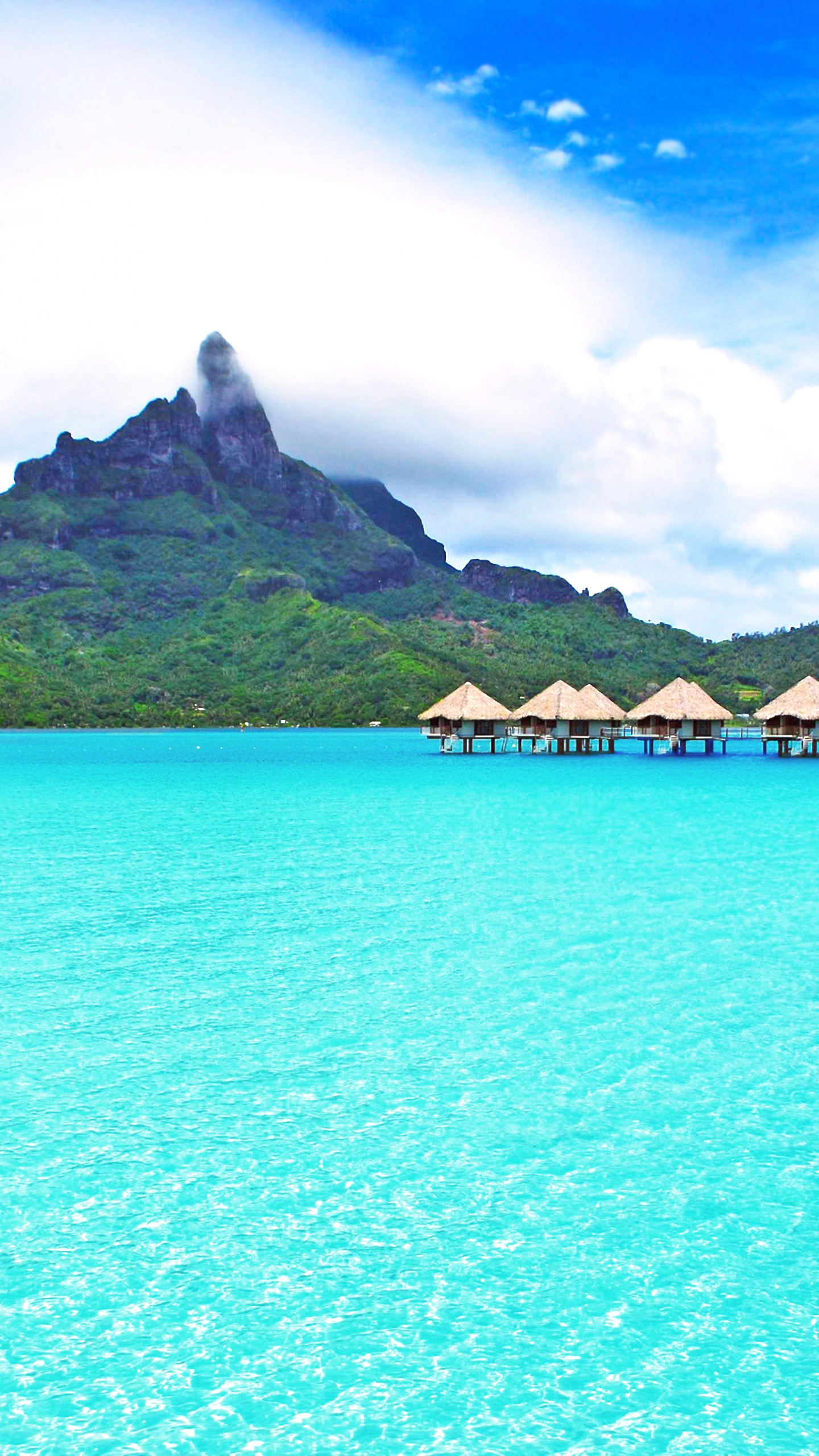 Brown Wooden House on Blue Sea Water Under Blue Sky During Daytime. Wallpaper in 1440x2560 Resolution