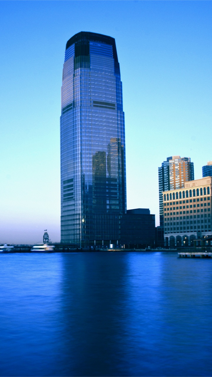 High Rise Building Near Body of Water During Daytime. Wallpaper in 720x1280 Resolution