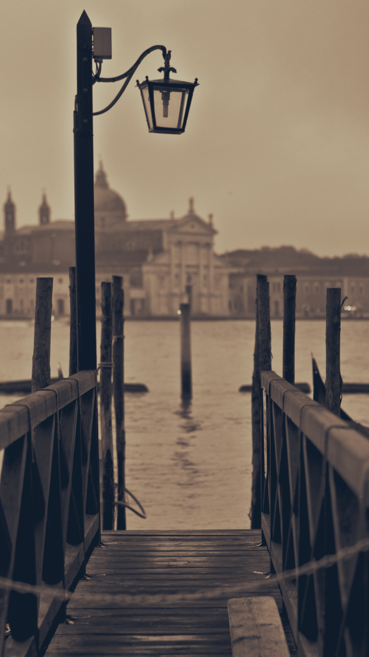 Brown Wooden Dock on Body of Water During Daytime. Wallpaper in 750x1334 Resolution