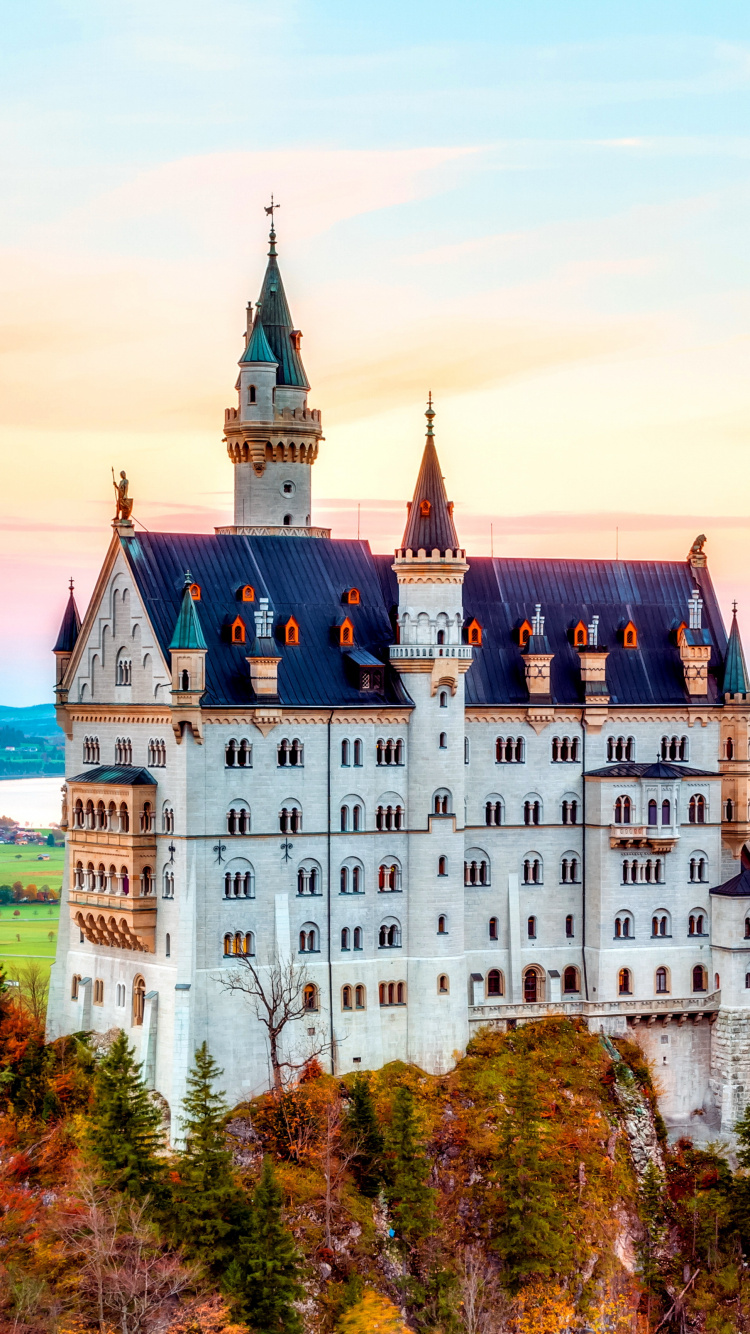 White and Black Castle on Green Grass Field During Daytime. Wallpaper in 750x1334 Resolution