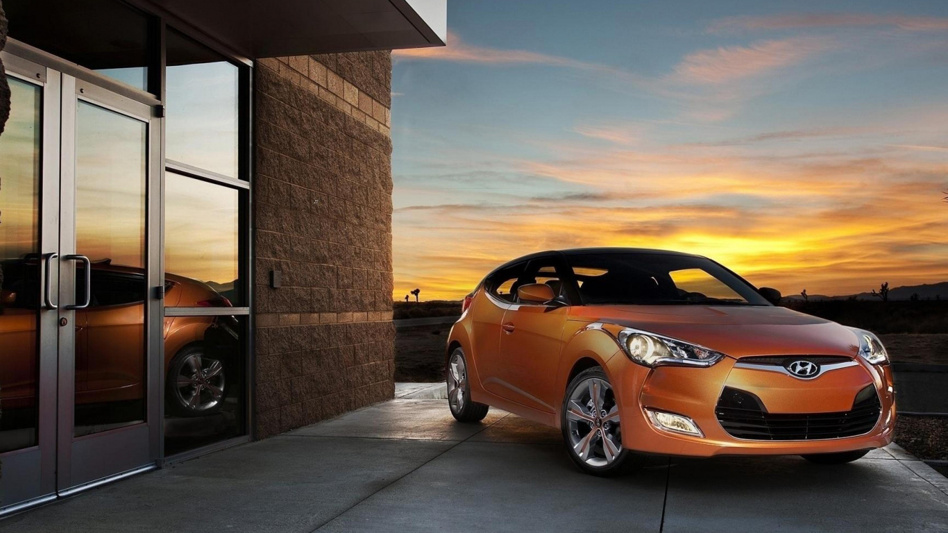 Orange Porsche 911 Geparkt in Der Nähe Von Braunem Betongebäude Tagsüber. Wallpaper in 1366x768 Resolution