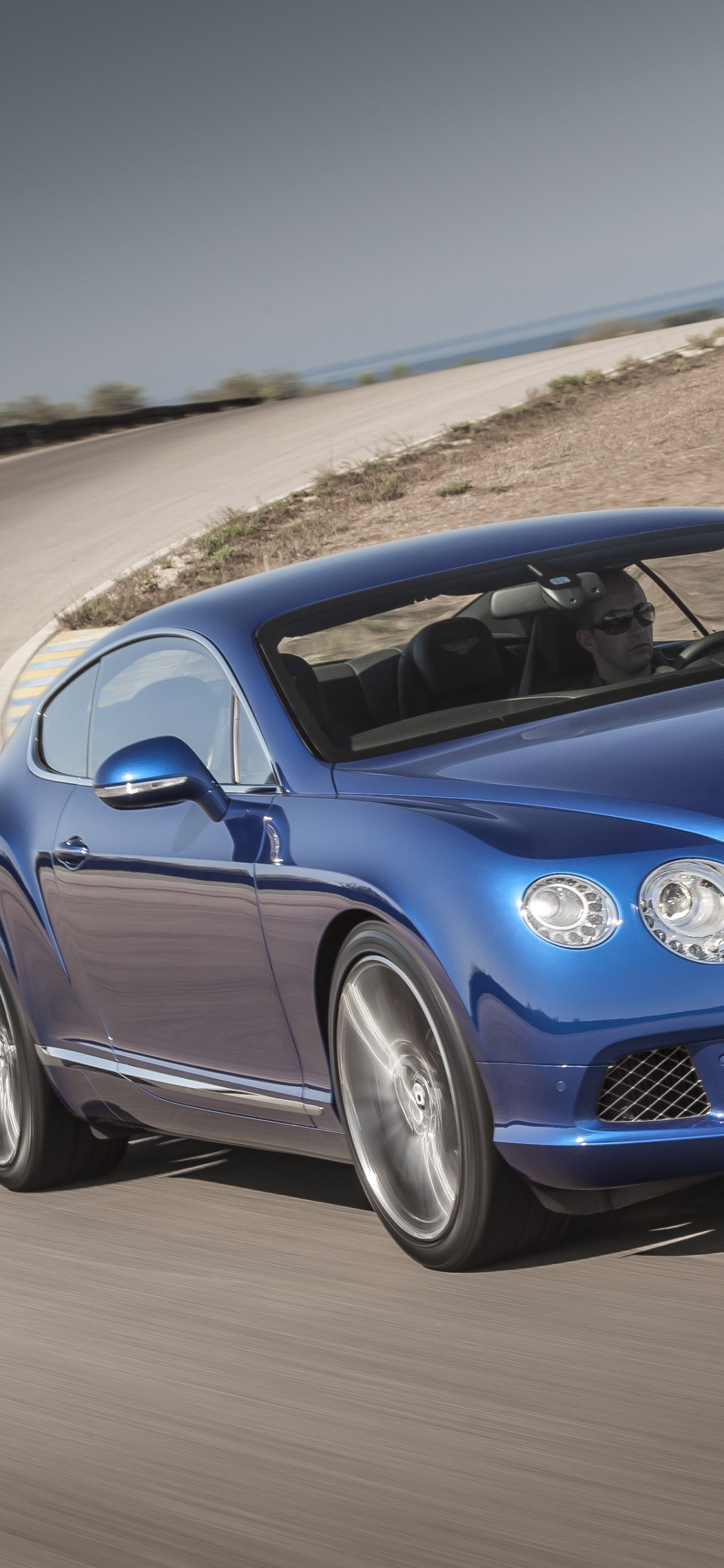 Blue Mercedes Benz Coupe on Road During Daytime. Wallpaper in 1242x2688 Resolution