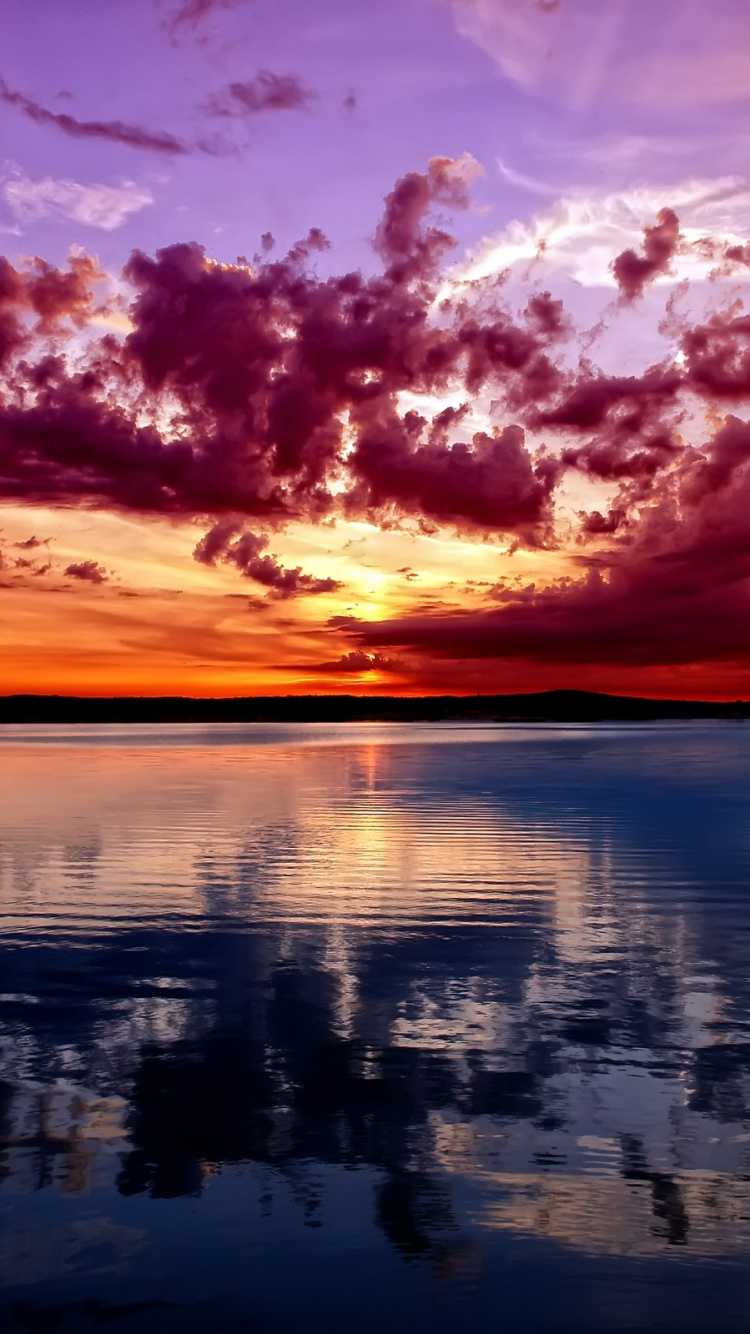 Body of Water Under Cloudy Sky During Sunset. Wallpaper in 750x1334 Resolution