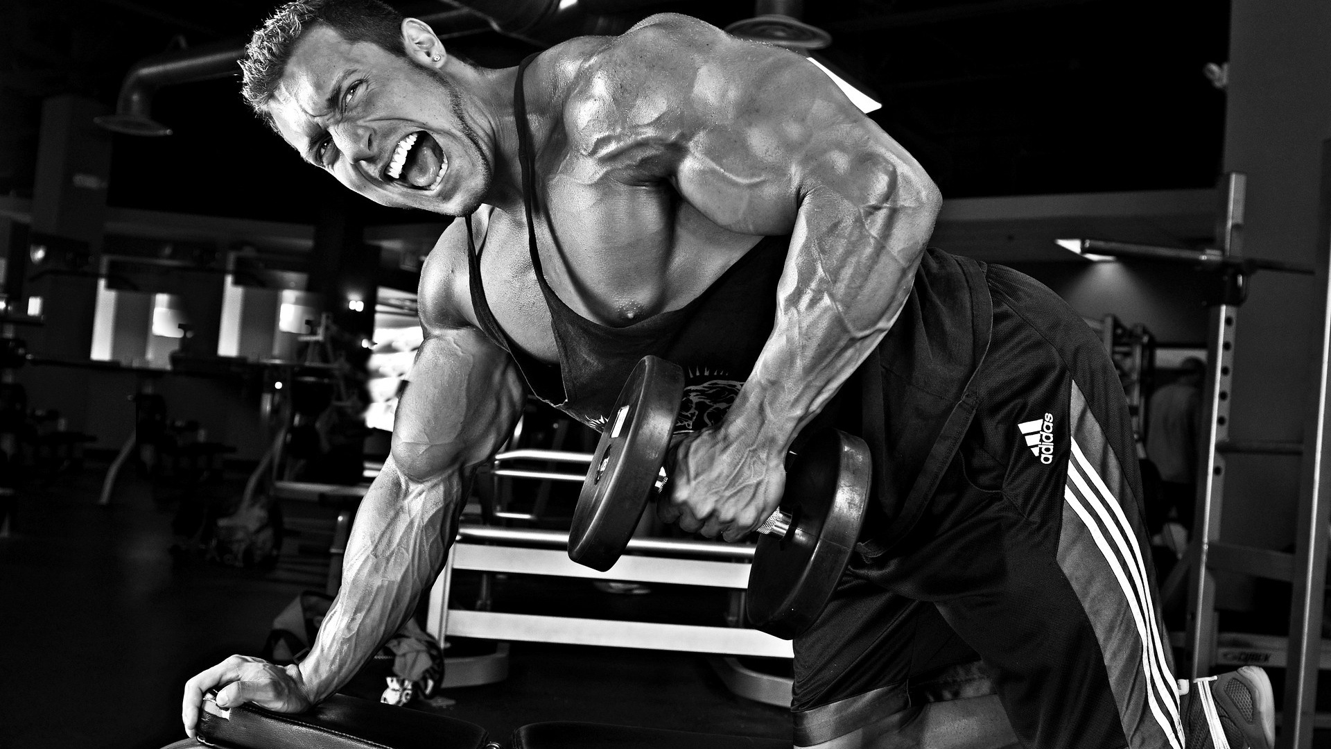 Man in Black Shorts Sitting on Black and Silver Exercise Equipment. Wallpaper in 1920x1080 Resolution