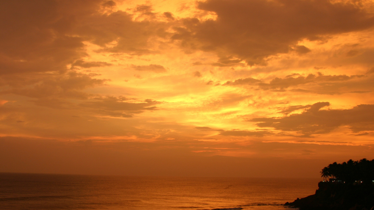 Body of Water Under Cloudy Sky During Sunset. Wallpaper in 1280x720 Resolution