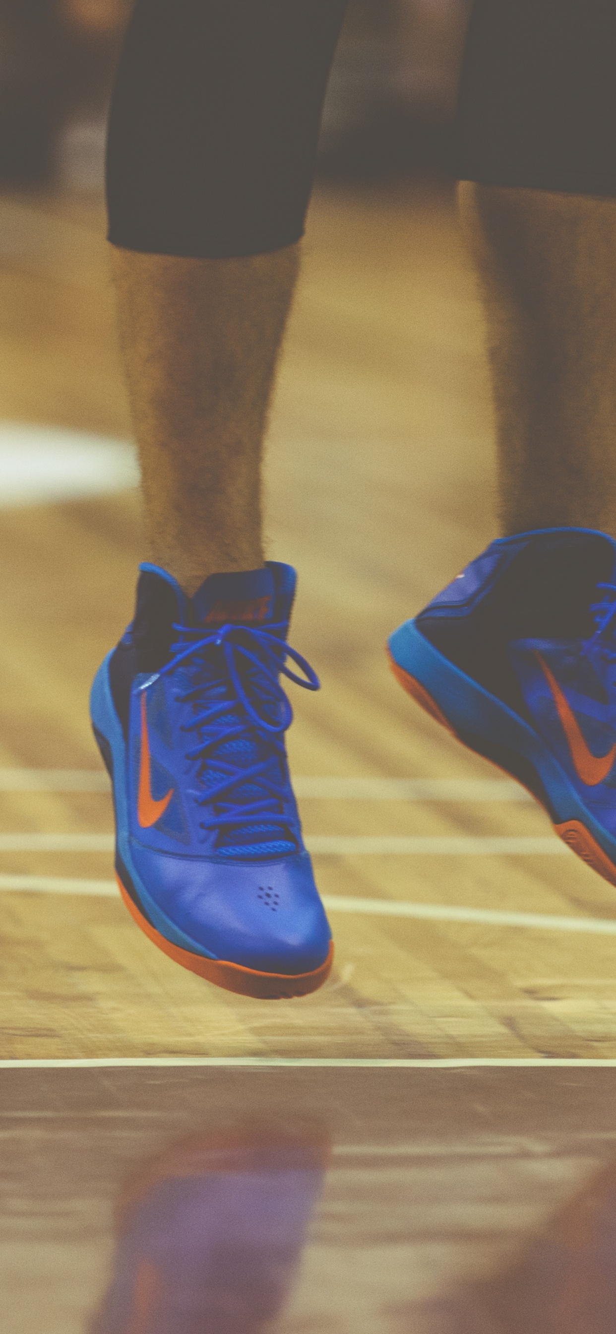 Person in Blue Nike Athletic Shoes. Wallpaper in 1242x2688 Resolution