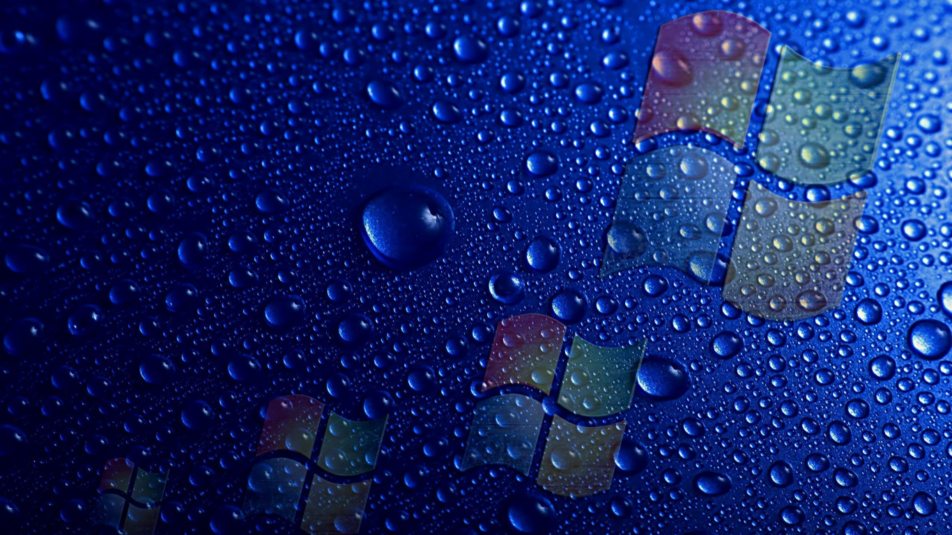 Gotas de Agua Sobre la Superficie Azul. Wallpaper in 1366x768 Resolution