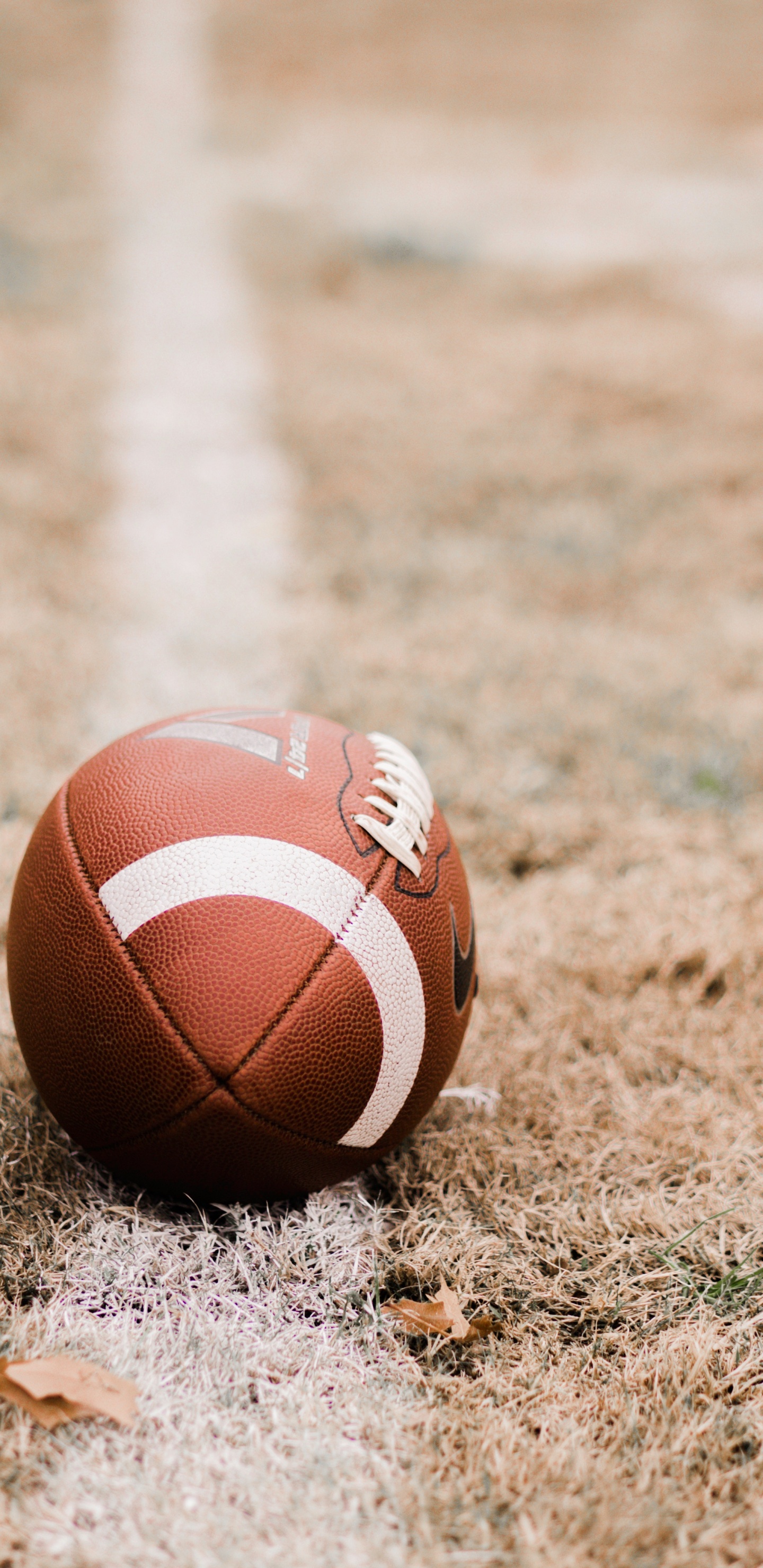 Brown Basketball on Brown Field During Daytime. Wallpaper in 1440x2960 Resolution