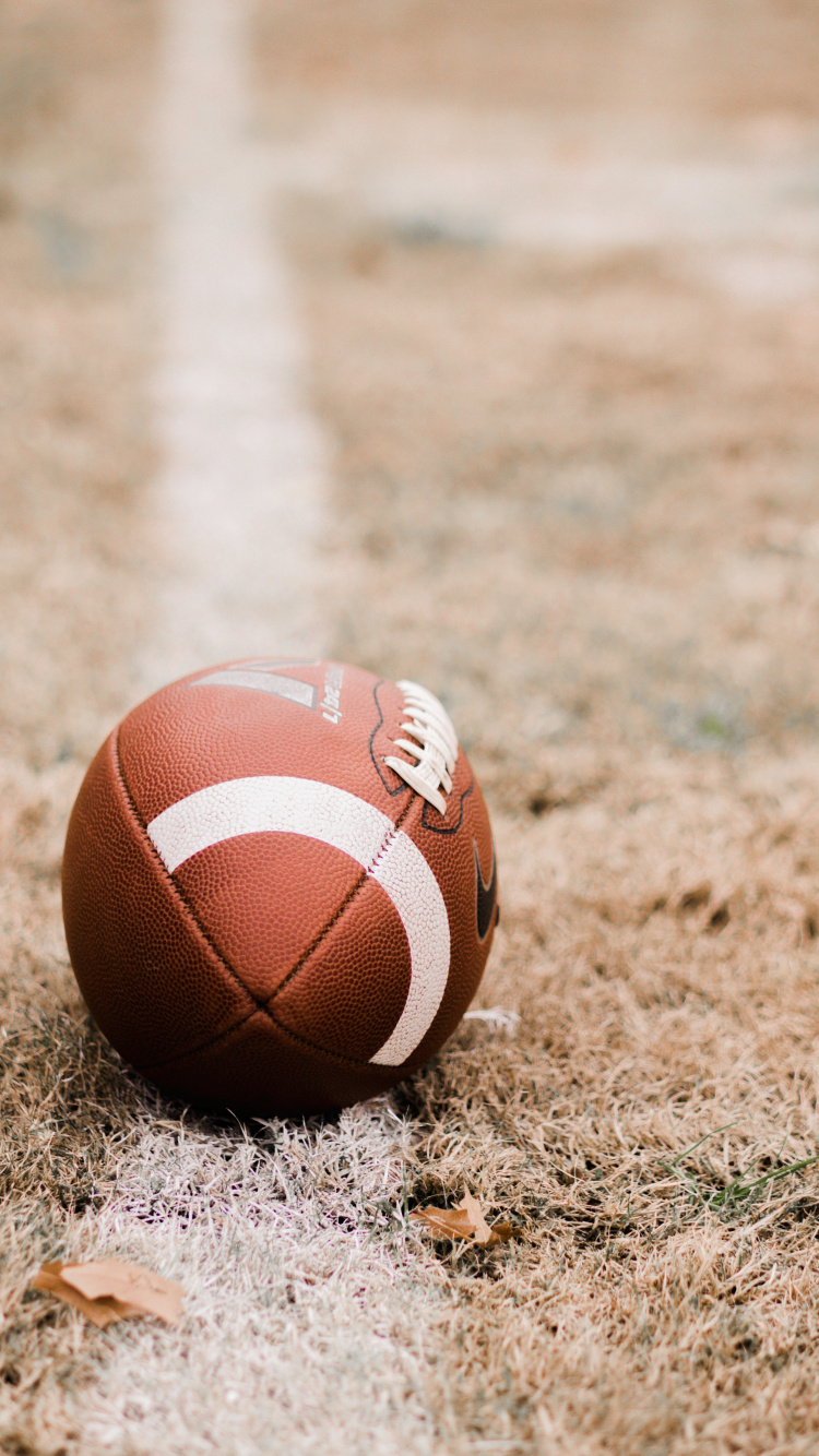 Brown Basketball on Brown Field During Daytime. Wallpaper in 750x1334 Resolution