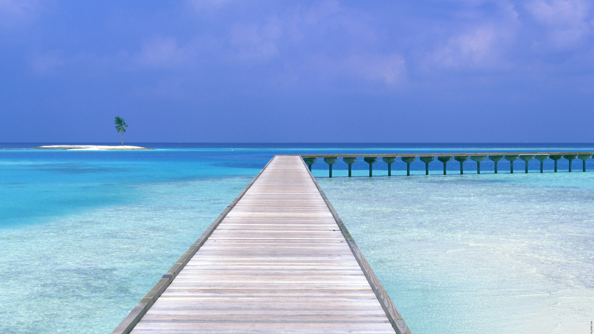 Brown Wooden Dock on Blue Sea Under Blue Sky During Daytime. Wallpaper in 1920x1080 Resolution