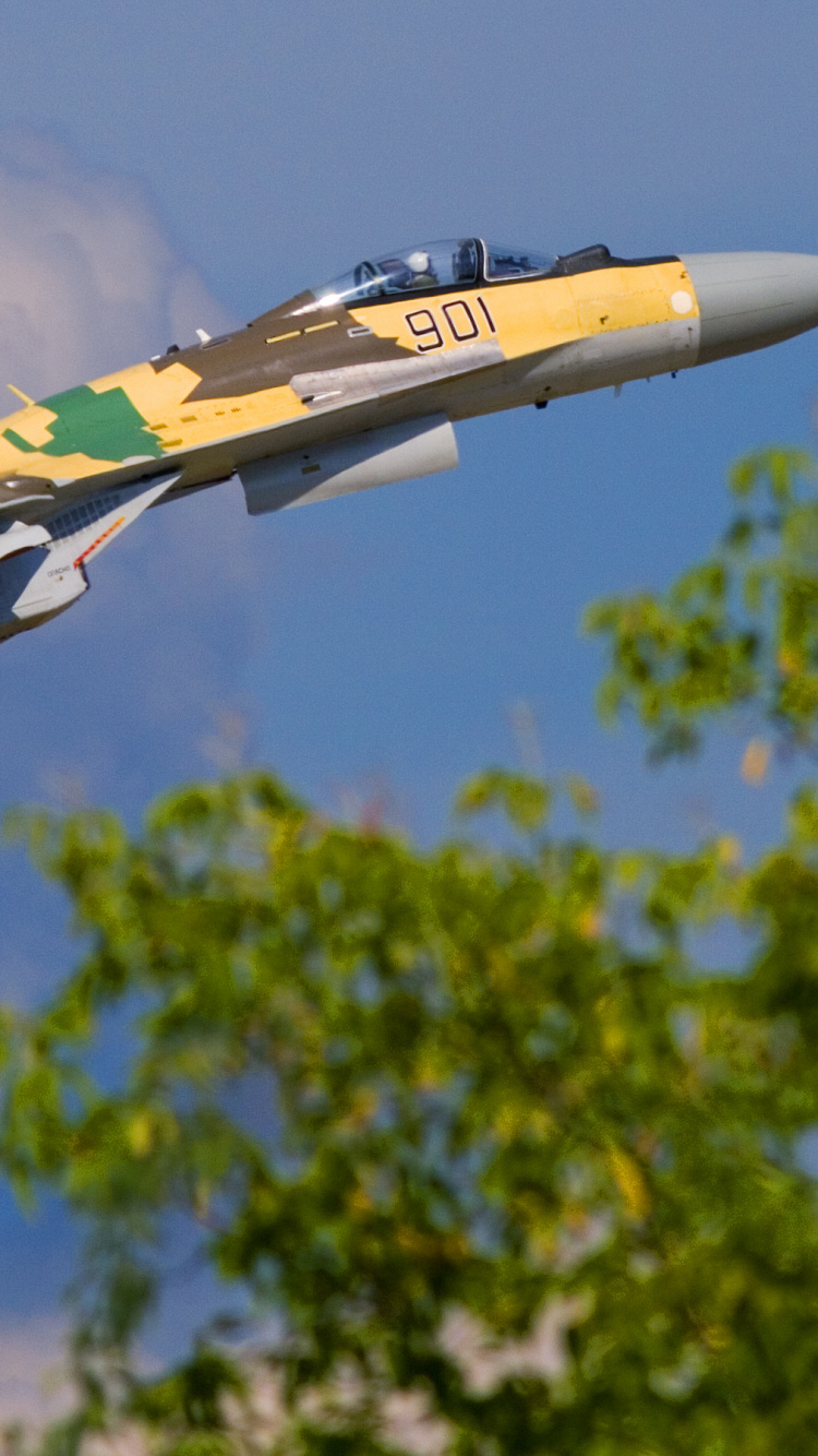 Yellow and White Jet Plane Flying in The Sky During Daytime. Wallpaper in 750x1334 Resolution