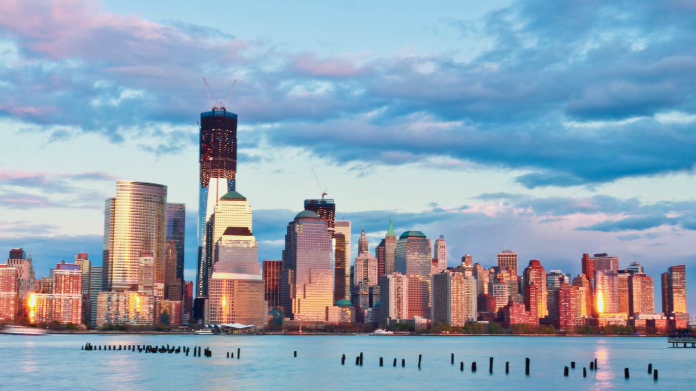 City Skyline Across Body of Water During Daytime. Wallpaper in 1366x768 Resolution