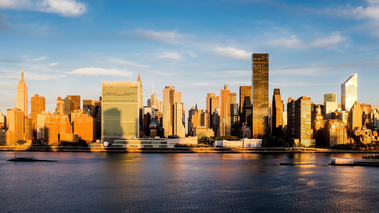 City Skyline Across Body of Water During Daytime. Wallpaper in 1280x720 Resolution