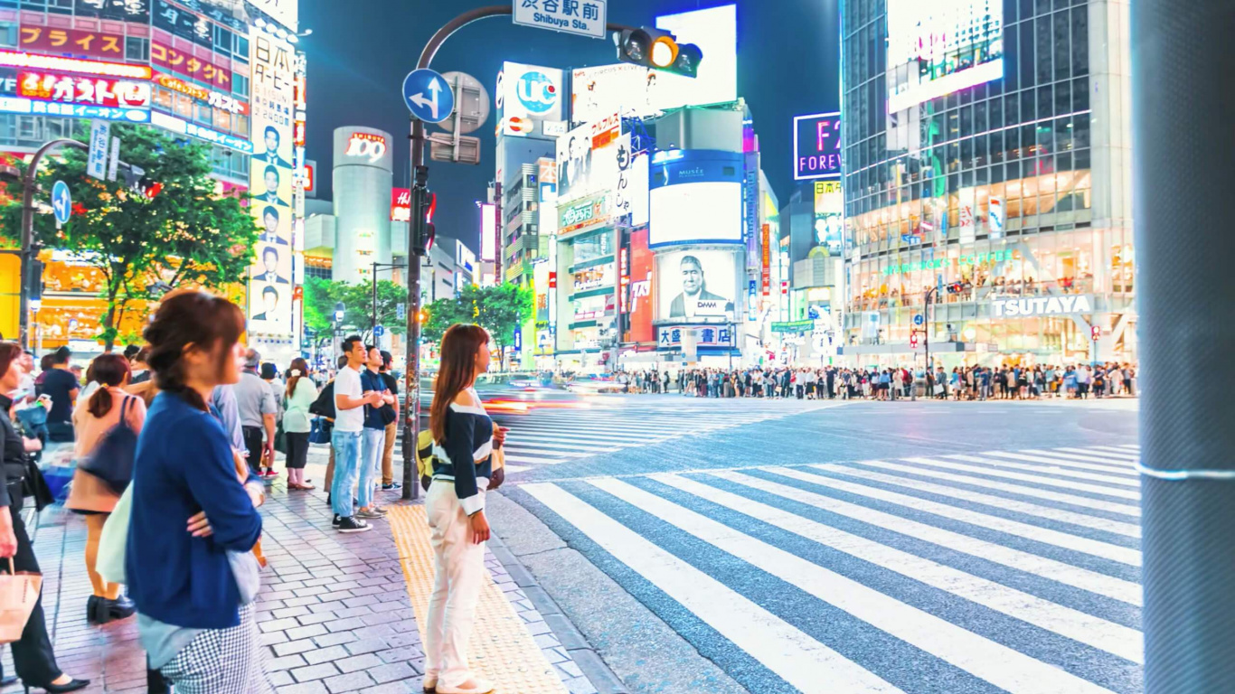 Woman in Black Long Sleeve Shirt and White Skirt Walking on Pedestrian Lane During Daytime. Wallpaper in 1366x768 Resolution