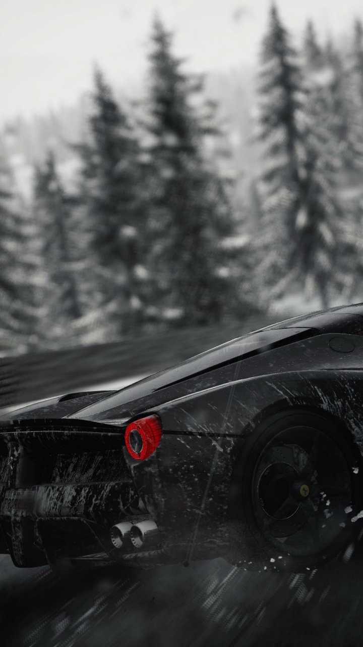 Black Ferrari 458 Italia on Snow Covered Road. Wallpaper in 720x1280 Resolution