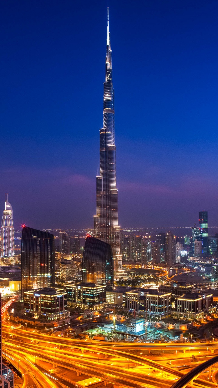 City Skyline During Night Time. Wallpaper in 720x1280 Resolution