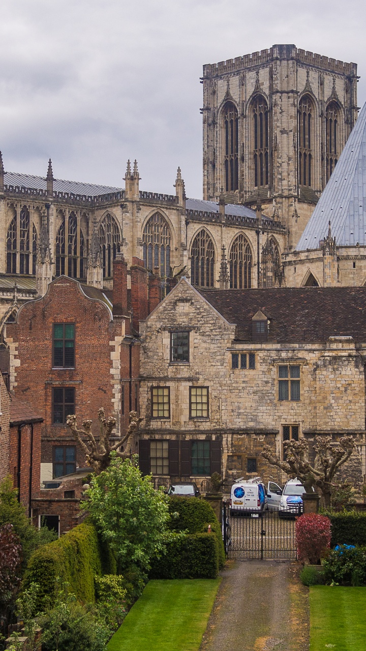 Brown Brick Building Near Green Trees During Daytime. Wallpaper in 720x1280 Resolution