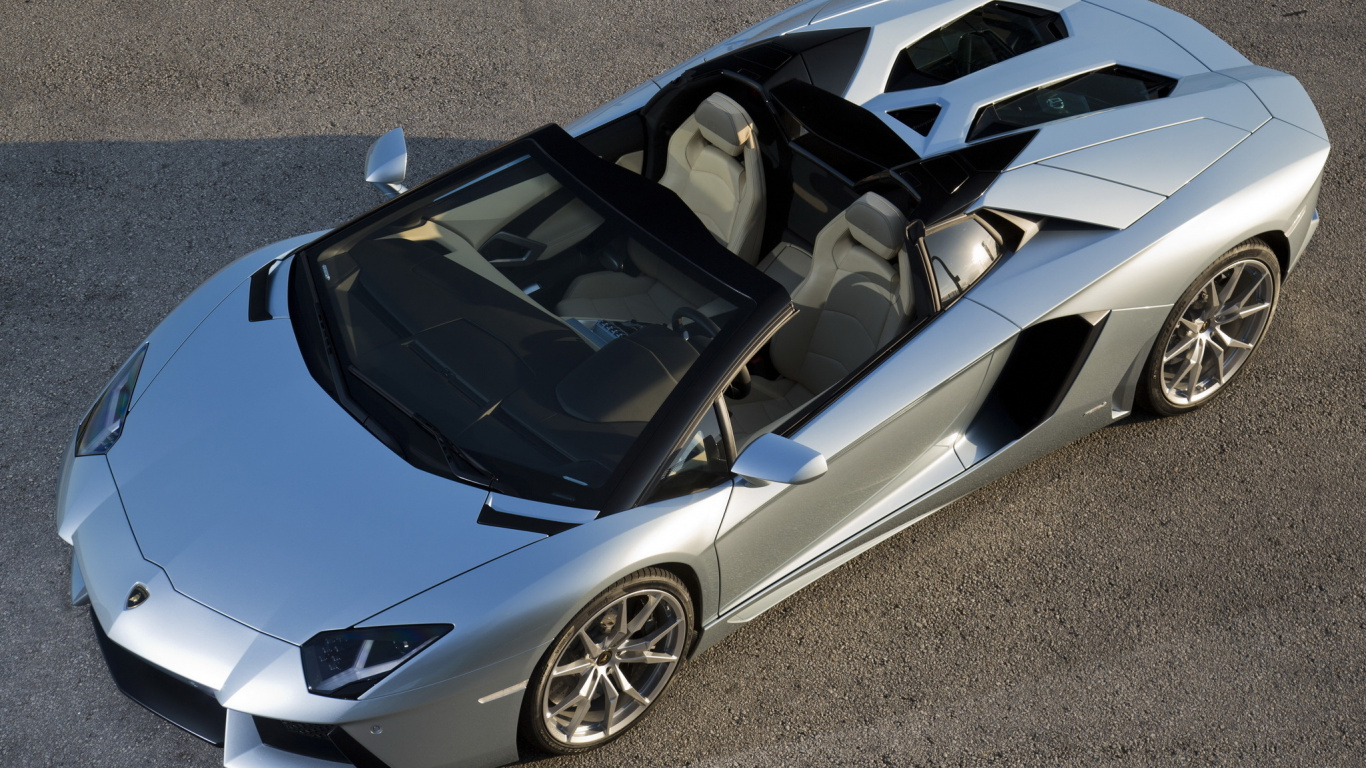 Porsche 911 Blanco y Negro Sobre Carretera de Asfalto Gris. Wallpaper in 1366x768 Resolution