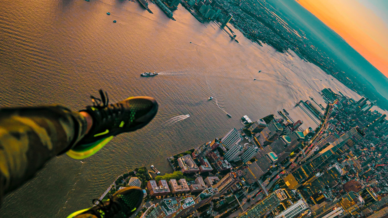 Aerial View of City Buildings Near Body of Water During Daytime. Wallpaper in 1280x720 Resolution
