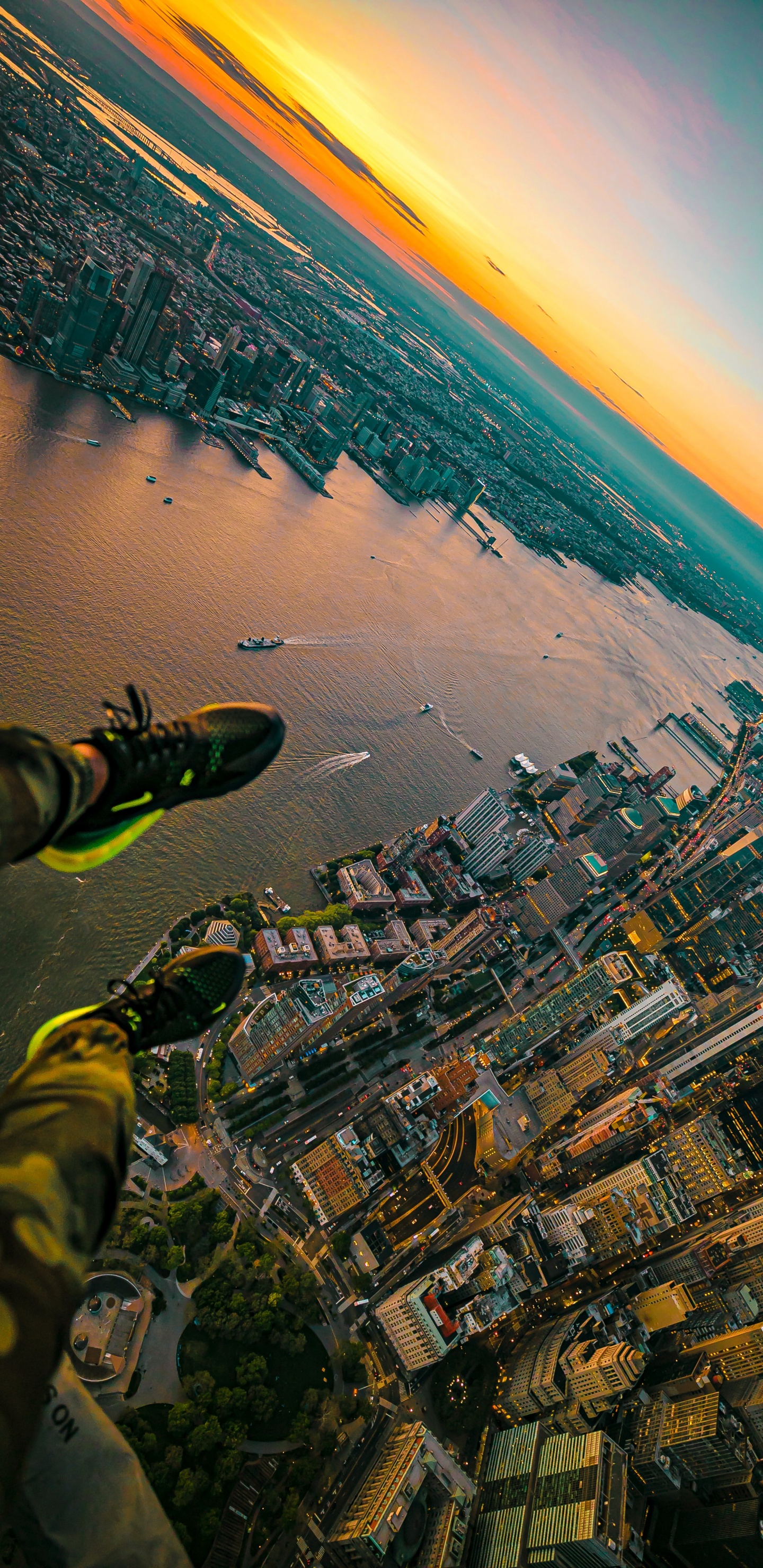 Aerial View of City Buildings Near Body of Water During Daytime. Wallpaper in 1440x2960 Resolution