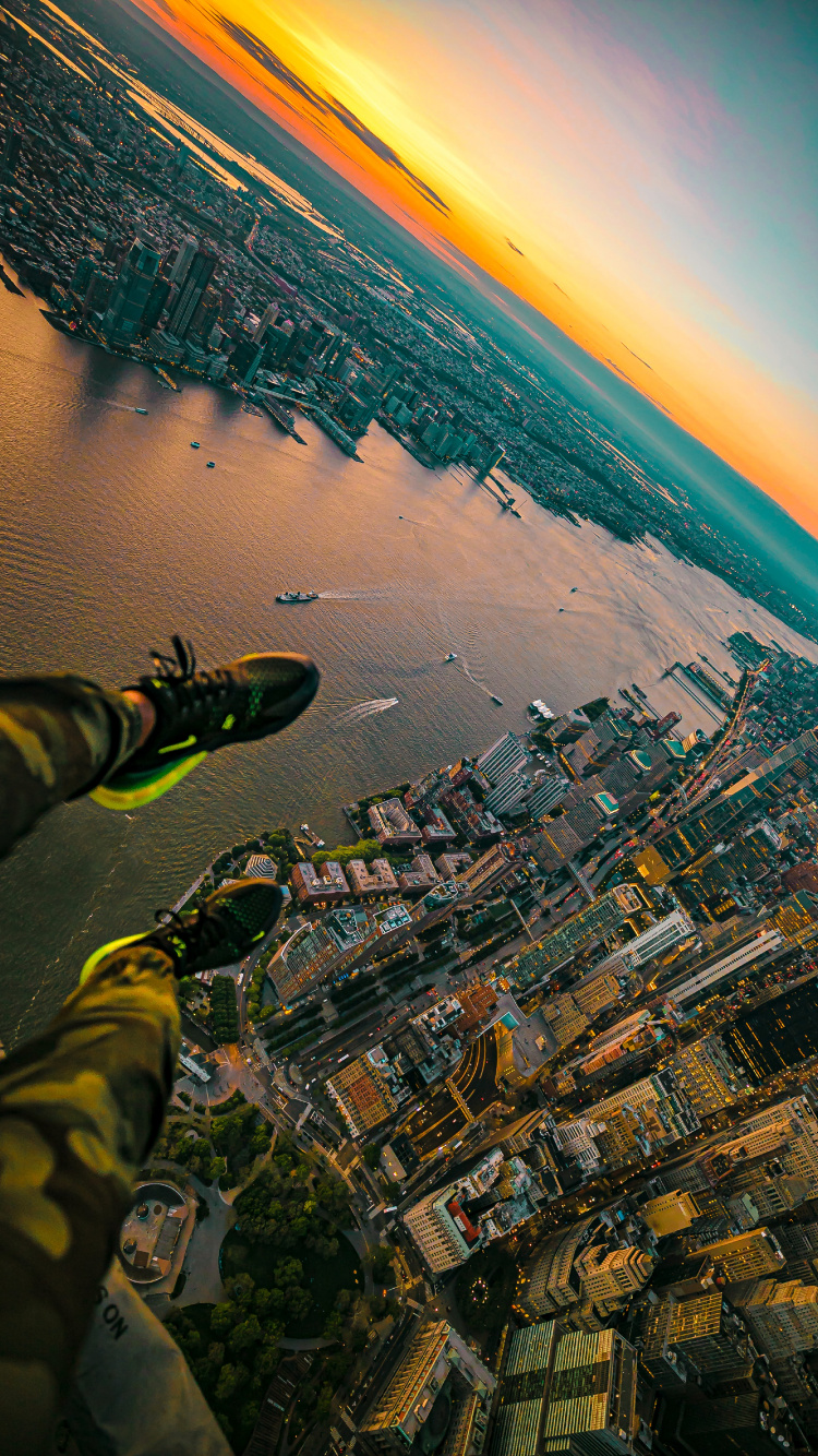 Aerial View of City Buildings Near Body of Water During Daytime. Wallpaper in 750x1334 Resolution