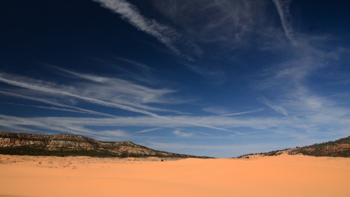 Image brown sand under blue sky during daytime