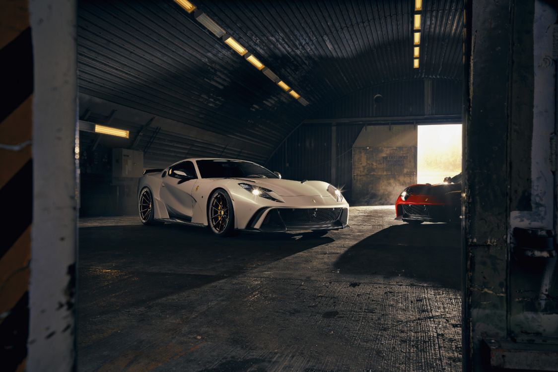 white porsche 911 parked in garage