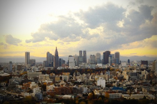 Image city buildings under white clouds during daytime