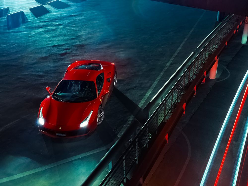 red ferrari sports car on bridge