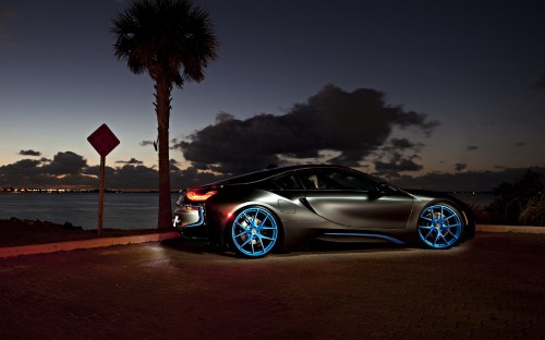 Image black coupe parked on dock during night time