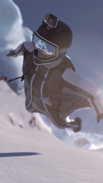 Image person in white and blue jacket and pants on snow covered field during daytime
