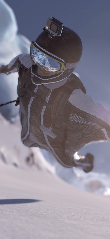 Image person in white and blue jacket and pants on snow covered field during daytime