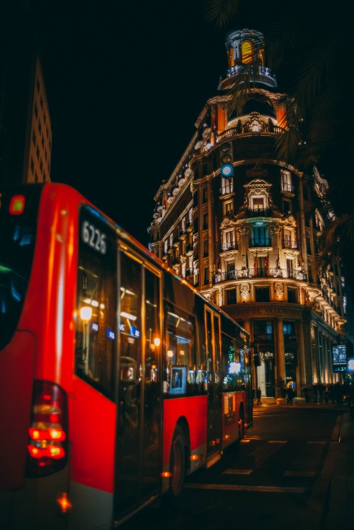 Image red double decker bus on road during night time