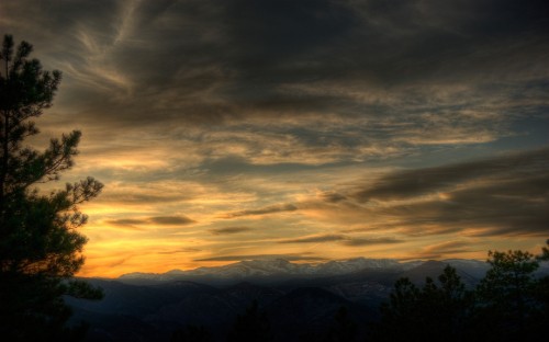 Image silhouette of trees and mountains during sunset