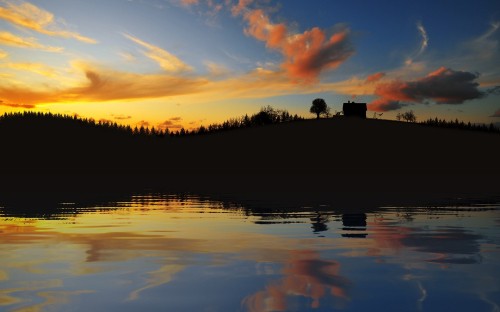 Image silhouette of trees beside body of water during sunset