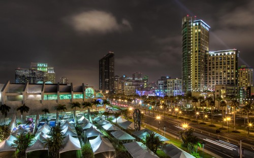 Image city with high rise buildings during night time