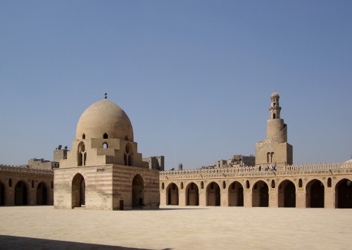 Image brown concrete dome building under blue sky during daytime