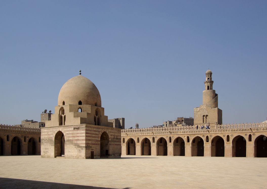 brown concrete dome building under blue sky during daytime